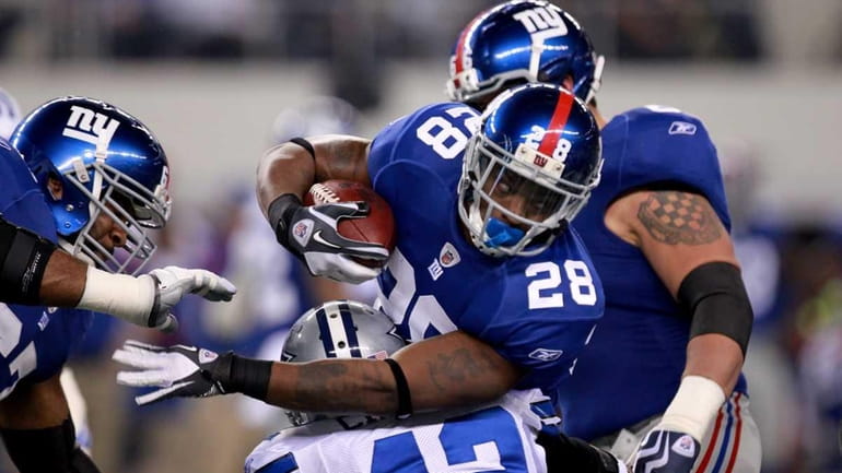 Running back D.J. Ware of the New York Giants is...