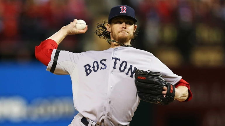 Boston Red Sox pitcher Clay Buchholz throws a pitch during...