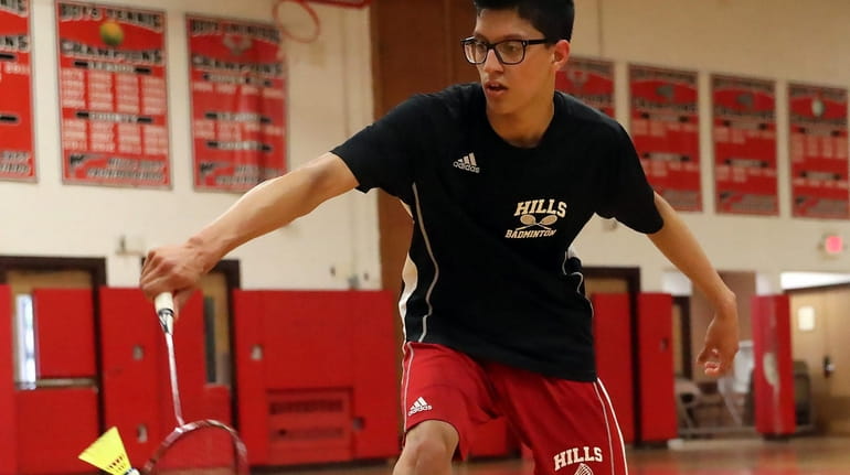 Hills East's Samie Zia with the backhand return at the...