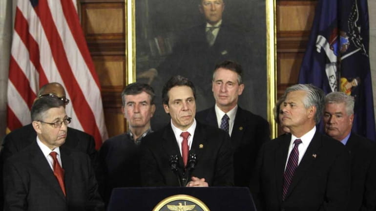 Gov. Andrew Cuomo and legislative leaders as they announced a...