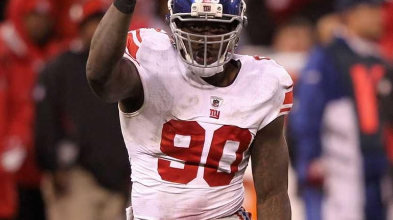 Jason Pierre-Paul of the New York Giants reacts against the...