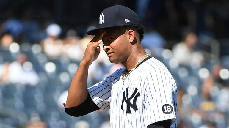 \Yankees starting pitcher Luis Gil reacts against Cleveland during an...