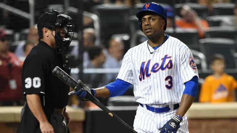 New York Mets rightfielder Curtis Granderson reacts after he strikes...