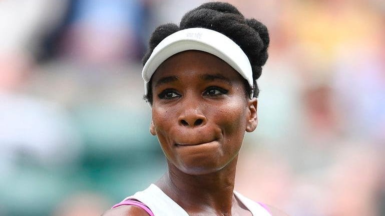 Venus Williams reacts between points against Belgium's Elise Mertens during...