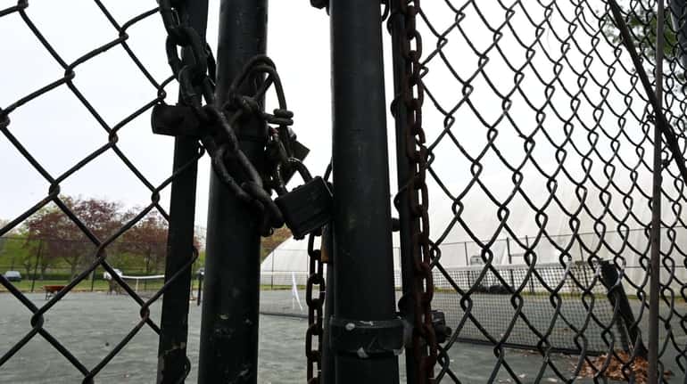 An outdoor court was padlocked at Bethpage State Park, Friday,...