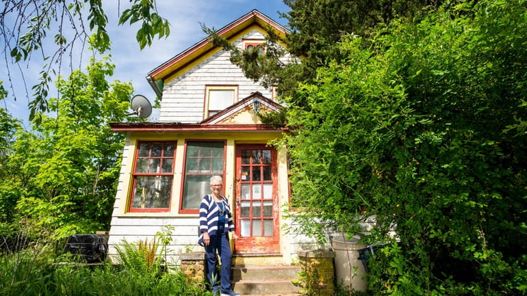 Real estate agent Victoria Swenson at an 1890 farmhouse in...