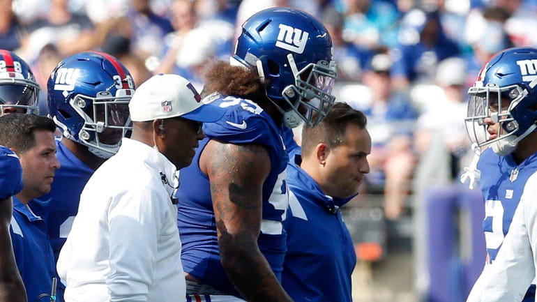 Leonard Williams of the Giants is tended too after an injury...