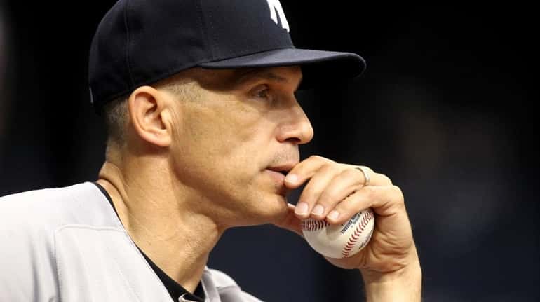 Manager Joe Girardi of the New York Yankees looks on...