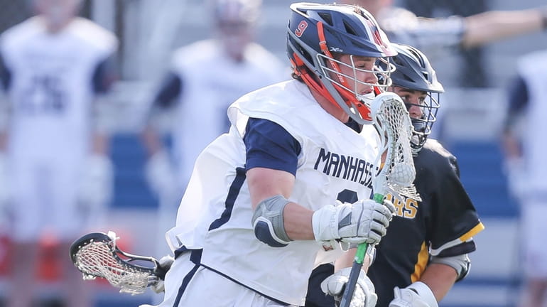 Manhasset's Cal Girard (9) looks to get by Wantagh's Danny...