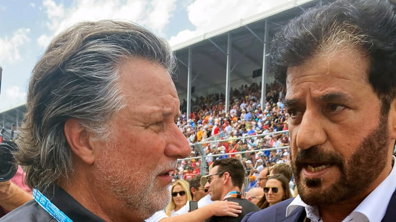 Michael Andretti, left, talks with FIA President Mohammed bin Sulayem...