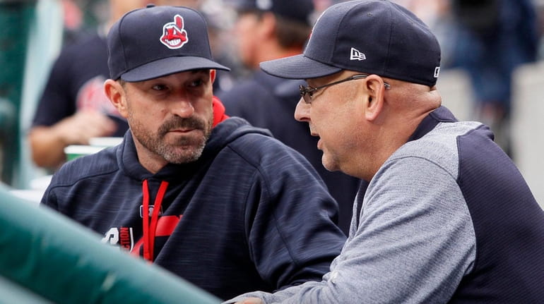 Pitching coach Mickey Callaway, left, of the Cleveland Indians talks...