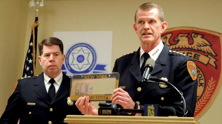 Suffolk police Chief Stuart Cameron, displays an altered license plate...