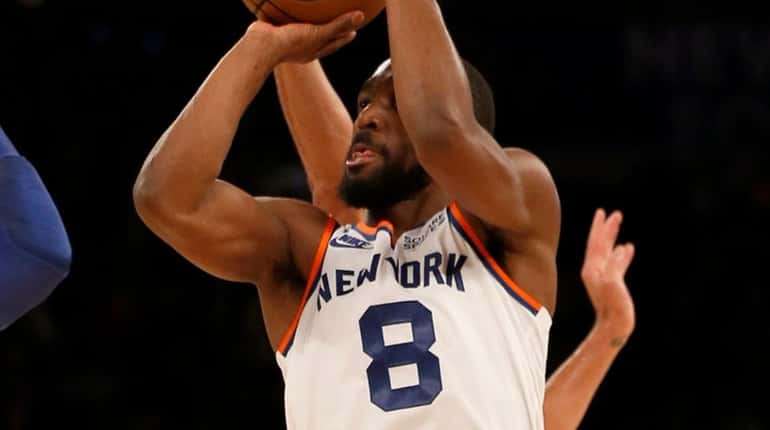 Kemba Walker of the Knicks hits a three point shot during...