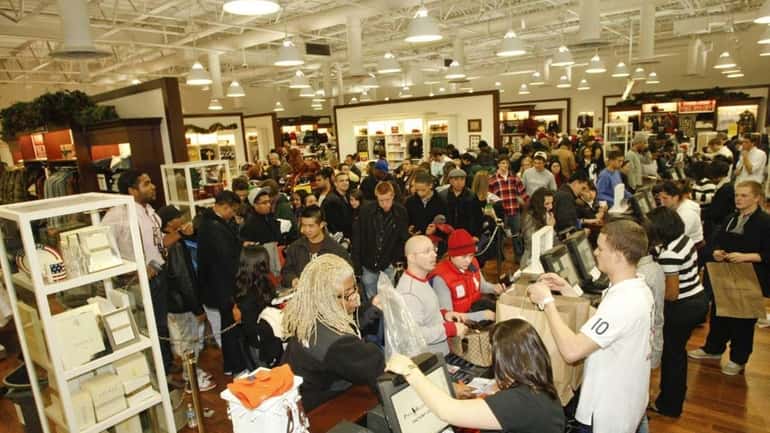 Shoppers pack Polo Ralph Lauren at Tanger Outlet Centers in...