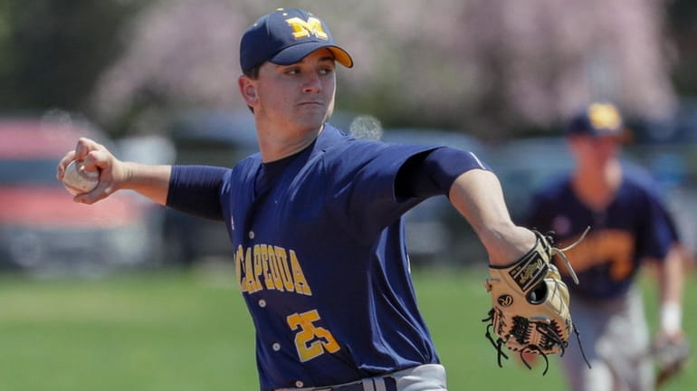Bobby Conlon #25 of Massapequa delivers the pitch against Syosset...