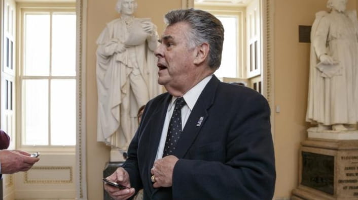Rep. Peter King stands outside the House chamber on Capitol...