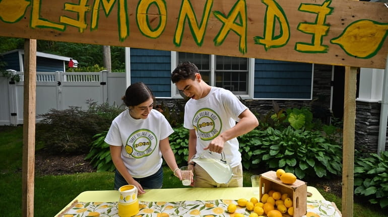 Joseph Mastriano pours a glass of lemonade for his sister Maddie...