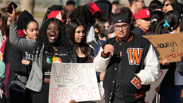 West High School students join with students from East High...