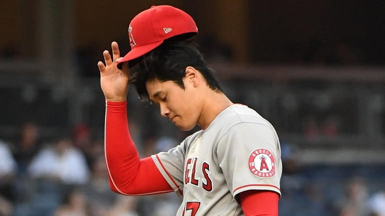 Angels starting pitcher Shohei Ohtani reacts against the Yankees during...