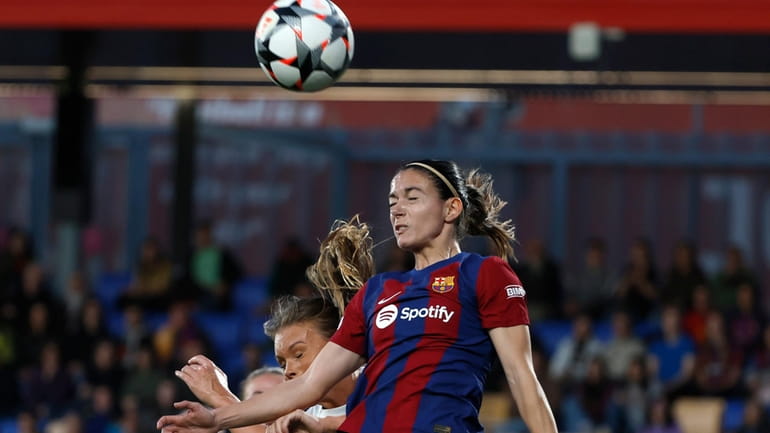 Barcelona's Aitana Bonmati heads the ball during the women's Champions...