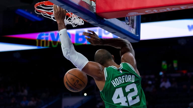 Boston Celtics' Al Horford dunks against the Philadelphia 76ers during...