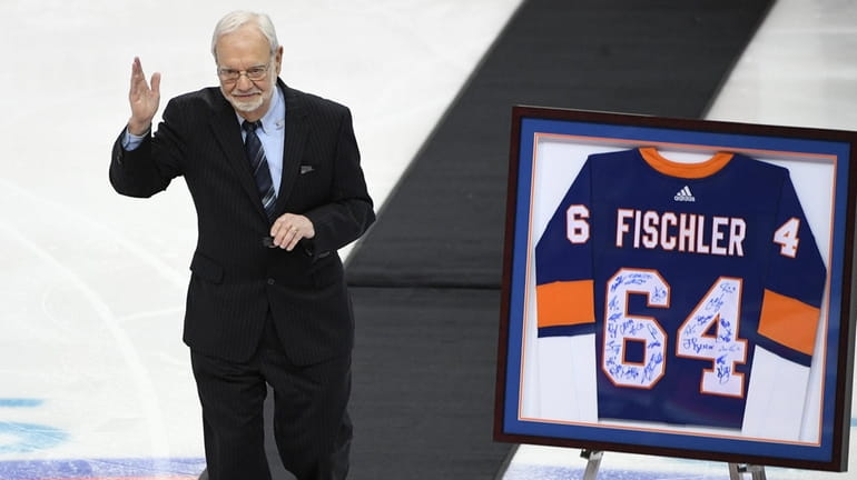 MSG broadcaster Stan Fischler is honored before a game between the...