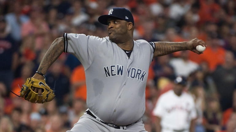 Yankees pitcher CC Sabathia throws a pitch during the first...