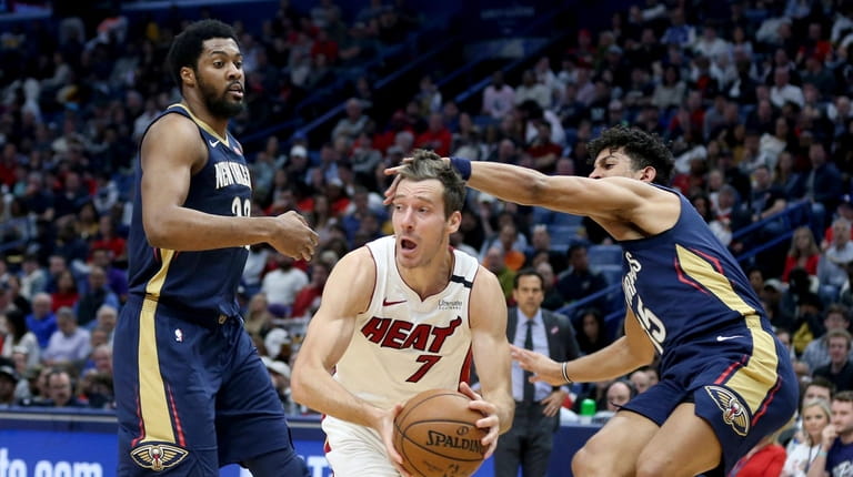 Miami Heat guard Goran Dragic (7) looks to pass the...