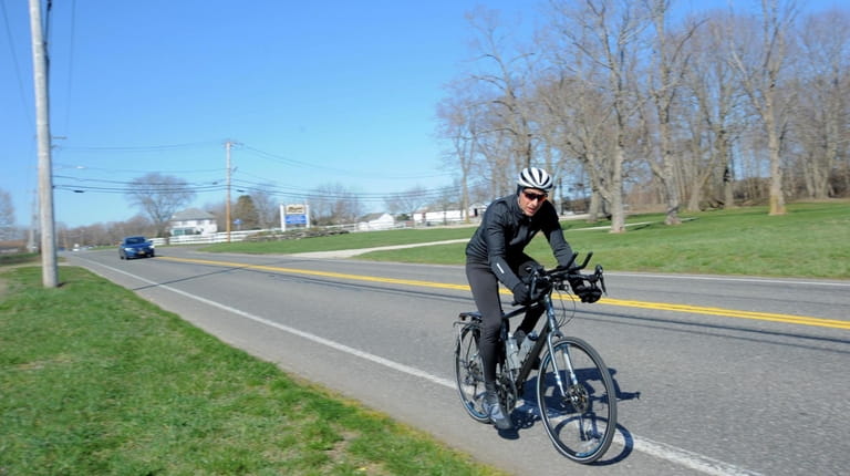 A bicyclist on Sound Avenue in Baiting Hollow