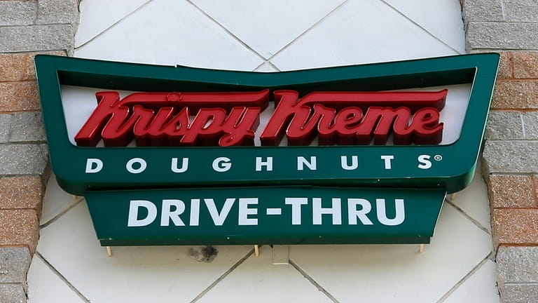 A Krispy Kreme Doughnuts sign is shown on Aug. 11,...