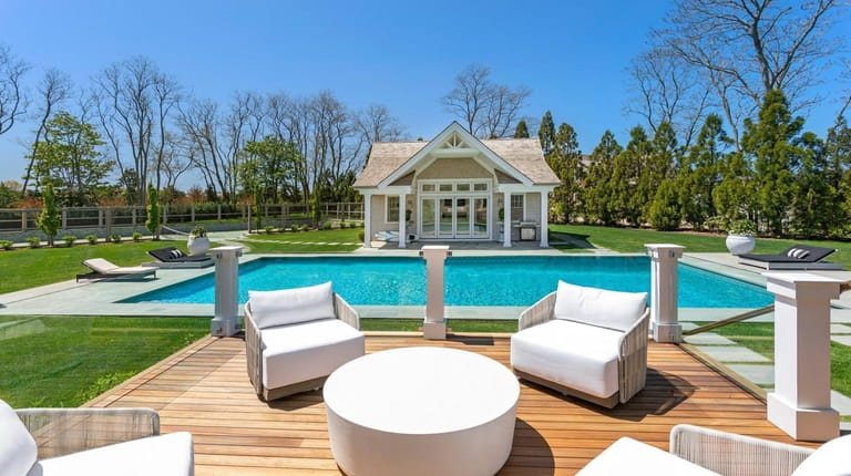 The property includes a 20-by-50-foot heated gunite pool and a pool house.