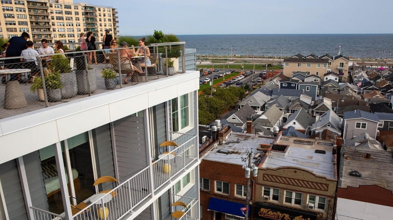 The Rooftop bar overlooking Rockaway beach at the Rockaway Hotel,...