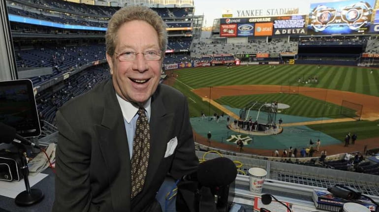 John Sterling sits in his booth before a baseball game...