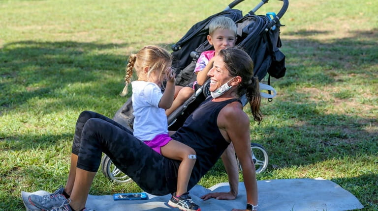 Fitness instructor Rachel Goodale, with her daughter Reagan, 2, and...