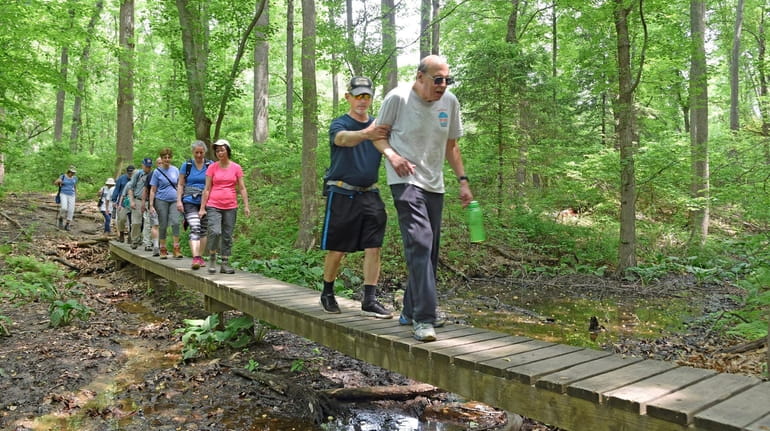 Hikers get some exercise through Blydenburgh Park in Smithtown on...