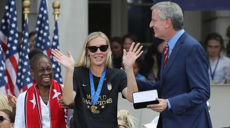 Allie Long of the United States women's national team receives...