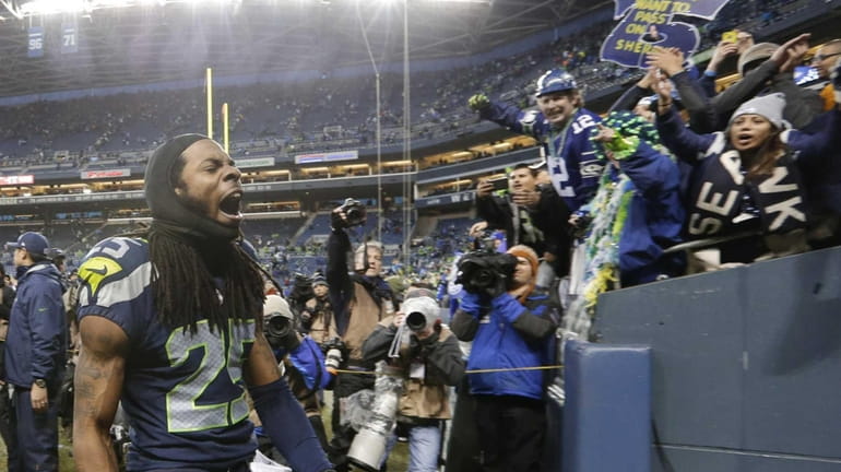 Richard Sherman celebrates after the Seahawks' 23-15 win over the...