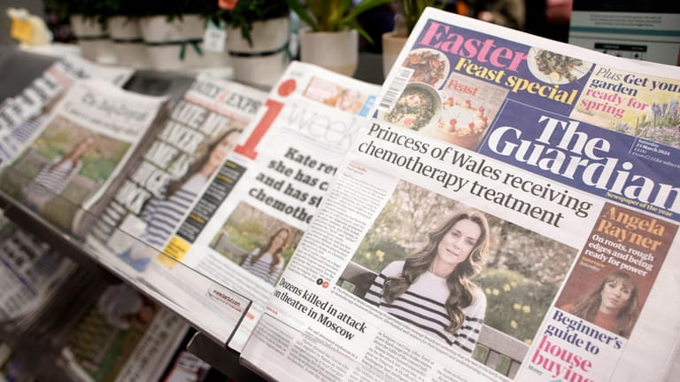 Newspaper front-pages are seen at a newsagent in London, Saturday,...