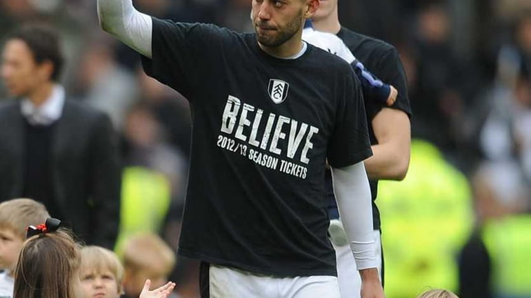 Clint Dempsey of Fulham puts his thumbs up after the...