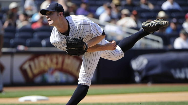 Relief pitcher David Robertson of the Yankees delivers during the...