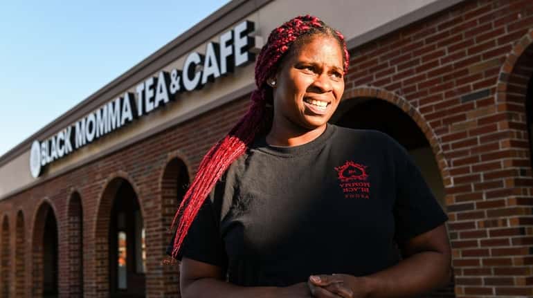 Vanessa Braxton, owner of Black Momma Tea & Cafe, stands...