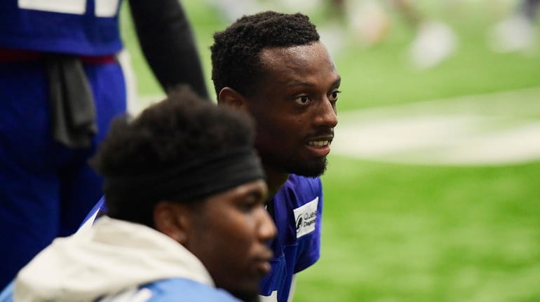 Eli Apple of the Giants looks on during training camp...