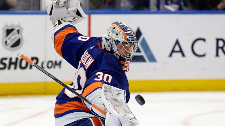 Ilya Sorokin #30 of the New York Islanders makes a...