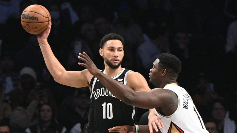 Nets guard Ben Simmons is defended by New Orleans Pelicans...