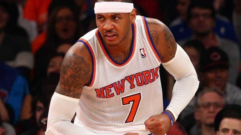 Carmelo Anthony celebrates a basket in the first half during...