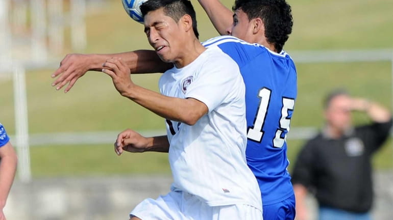 East Hampton's JC Barrientos and Christian Molina go up for...