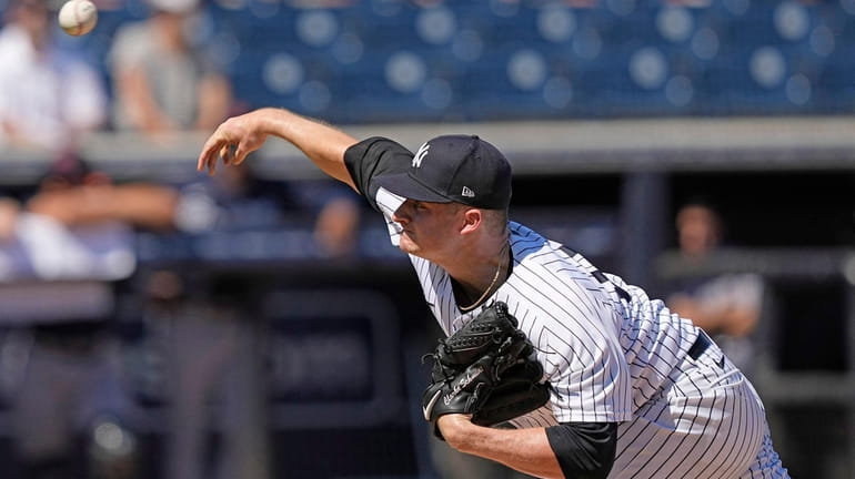 Yankees pitcher Clarke Schmidt throws during the first inning of...