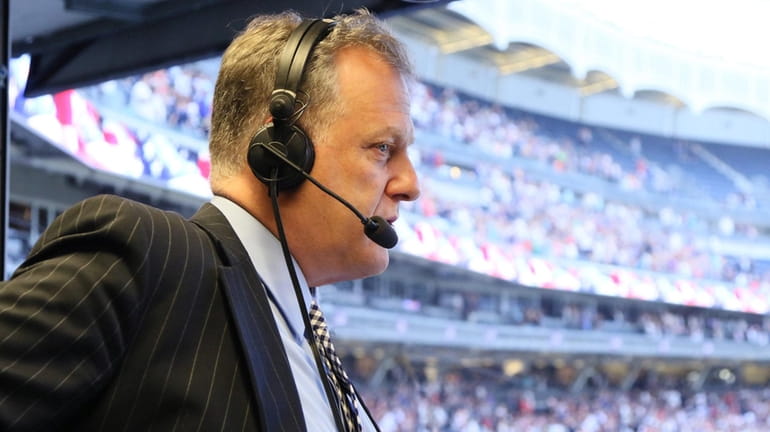 Yankees play-by-play announcer Michael Kay in the YES Network booth...
