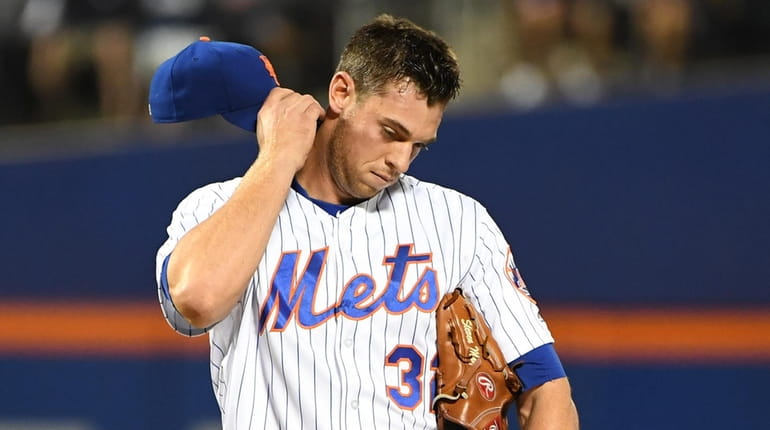 New York Mets starting pitcher Steven Matz reacts on the...