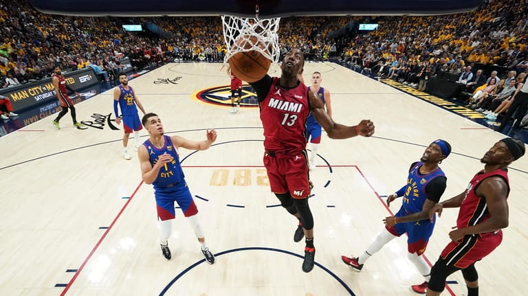 Miami Heat center Bam Adebayo (13) dunks against the Denver...